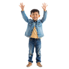 Young boy raising his hands in the air, looking happy and carefree on a white background