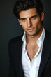 © GoodandEvil - Chiselled man with green eyes and dark hair posing.