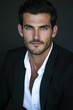 © GoodandEvil - Portrait of man in suit with a serious expression