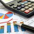 © Aqsapics - financial charts and graphs on the table