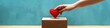 © AIGen - Heart Donation. Concept of Love and Charity with Hand Putting Red Heart Symbol into Donation Box