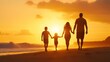 © BoOm - A family walks hand in hand along the beach at sunset, enjoying a moment of togetherness and tranquility in nature.