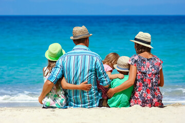 Canvas Print - A Happy family with children on the coast of the sea travel