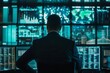 © DK_2020 - A government official in a secured operations center, watching a large screen displaying a cyber attack in progress, coordination and control behind state sponsored hacking efforts