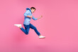 © deagreez - Full body photo of cute teen boy running hurry winning dressed stylish blue clothes isolated on pink color background
