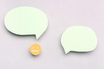 Sticker - Paper face with blank speech bubbles on grey background