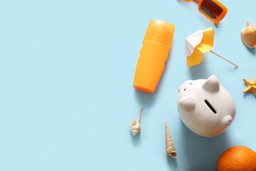 Wall Mural - Piggy bank, sunscreen, seashells and decorative umbrella on blue background