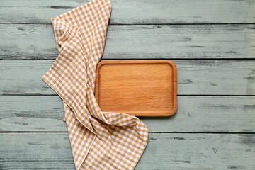 Wall Mural - Table setting with board and napkin on grey wooden background