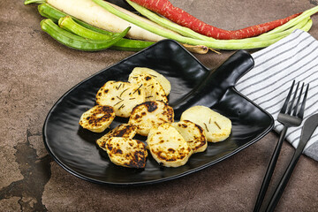 Canvas Print - Baked potato slices with herbs