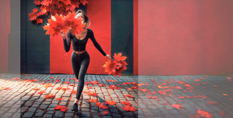 Wall Mural - a woman in a coat and a leaf that has fallen from the tree