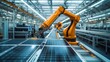 © Humeyra - An orange industrial robot arm is featured at the production line in a modern bright factory where solar panels are assembled on a conveyor in an automated manufacturing facility