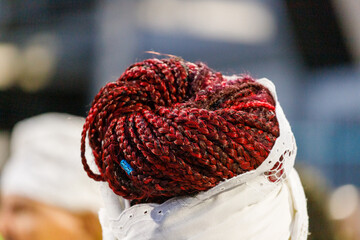 red hair braid on a woman's head in Rio de Janeiro.