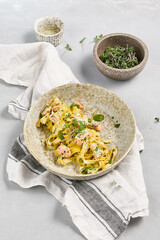 Sticker - Fettuccine Pasta with Salmon and Cream Sauce on Rustic Linen Background