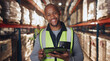 © peopleimages.com - Portrait, stock and tablet with black man in warehouse for online order of distribution or shipping for delivery. Inventory, logistics and smile with happy person in storage depot for inspection