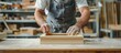 © Sunshine - Skilled Carpenter Working on Wooden Frame in Workshop, Hands Close-Up, Craftsmanship and Woodworking Concept