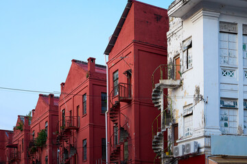 Old red buildings with spiral staircases in ipoh, malaysia