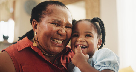 Poster - Smile, grandmother and child laughing at house for bonding, love and care together for family support. Happy, senior black woman and girl, embrace and funny joke, affection or retirement in lounge