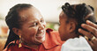 © AzeemudDeen/peopleimages.com - Happy, senior and black woman with child at house for family bonding, affection and connection of care in lounge. Smile, grandmother and girl with embrace, love and relax together for childhood trust