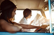 © Hira/peopleimages.com - Women, friends and drive on minivan with map for direction, route and navigate on road trip in Brazil. People, tourist and location or destination for traveling, adventure and holiday as tourists
