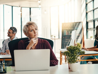 Poster - Mature woman, designer and thinking with laptop for web design, ideas or improvement at office. Creative, female person or journalist in wonder for content creation, online service or startup