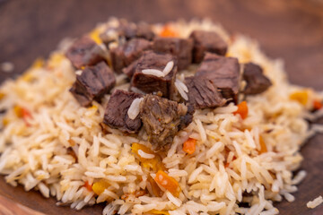 Wall Mural - A plate of rice and meat with carrots on top