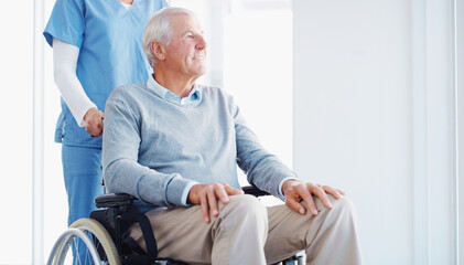 Wall Mural - Caregiver, happy and old man in hospital, wheelchair and compassion for senior patient with disability. Clinic, nurse and elderly person with smile, care and support for healthcare and wellness