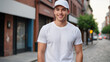 © QuoDesign - Young man wearing white t-shirt and white baseball cap standing on the street