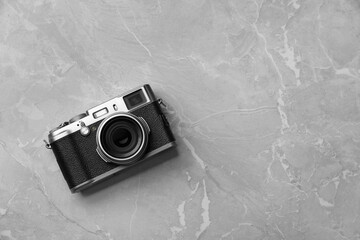 Canvas Print - Vintage photo camera on grey marble table, top view. Space for text