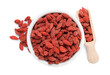 © New Africa - Dried goji berries in bowl and scoop isolated on white, top view