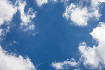 Wall Mural - Blue sky background and white clouds soft focus, space in the middle, horizontal shape.