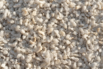 Wall Mural - A close-up image of white gravel stones, ideal for backgrounds, textures, and construction-related themes.