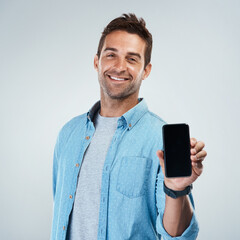 Wall Mural - advertising, phone screen and portrait with smile of man in studio on white background for communica
