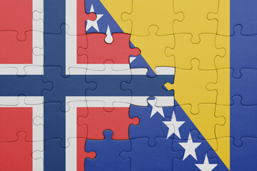 puzzle with the colourful national flag of bosnia and herzegovina and flag of norway .