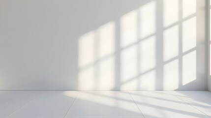 Poster - A bright white room with light shining through the window, casting soft shadows on an empty wall. creating an abstract and minimalist background for product display or presentation