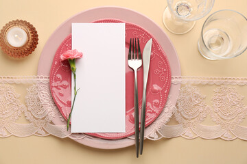 Wall Mural - Empty menu, tableware, candle and floral decor on beige table, top view. Mockup for design