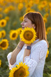 © Олег Мальшаков - Beautiful young girl in a white dress in sunflowers