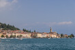 Salo charming promenade on Lake Garda, featuring bustling bar and scenic views, captures the essence of a vibrant Italian lakeside town