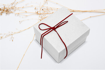 Poster - Kraft gift box mockup png with red bow rope in minimal style