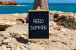 © Dzmitry - Hello summer symbol. Concept words Hello summer on beautiful yellow blackboard. Beautiful red stone beach blue sky sea background. Business lifestyle Hello summer concept. Copy space.