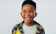 © ReeseBuyout1/peopleimages.com - Thinking, smile and black child in studio for fashion, excited and summer fun. Young kid, happy and idea on white background for positive energy, confident or school profile update in Nigeria