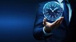© Stocks Buddy - Businessman holding glowing holographic clock on dark blue background showcasing time management, modern technology, futuristic concept