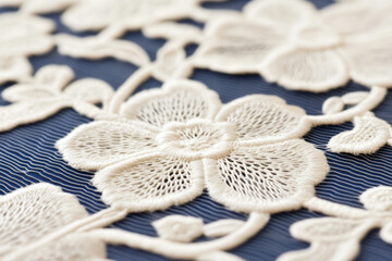 Wall Mural - Intricate ivory lace flower pattern on navy fabric, ideal for vintage fashion design or Mother's Day craft projects