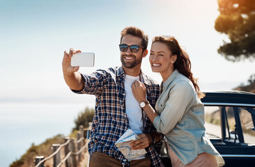 Poster - Couple, happy and selfie by car on road trip for journey documentation, explore and bonding outdoor. Man, woman and together with scenic view, travel photography and adventure blog with love or care.