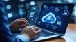 © Nuttaya Nampai - A professional working on a laptop with cloud computing icons, representing digital transformation and technology integration