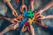 © VikaKa - A group of diverse hands holding colorful puzzle pieces that fit together perfectly, symbolizing the idea that each person's unique qualities can contribute to an overall whole or team success