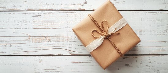 Poster - Elegant gift box displayed on a white wooden surface perfect for a copy space image