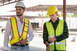 © Poguz.P - Technician engineer in hardhat working at construction site, Foreman worker on a construction site