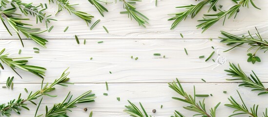 Poster - Flat lay of dry and fresh rosemary on a white wooden table with copy space image for text placement