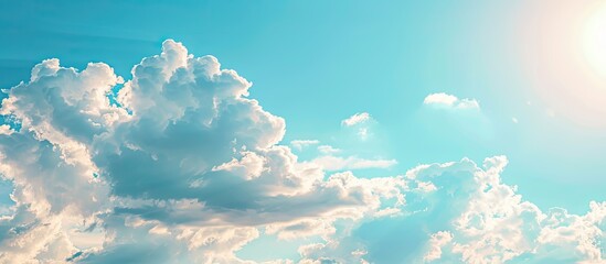 Poster - Sunny day with a blue sky and fluffy white clouds background symbolizing hope Copy space image available