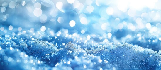Leinwandbilder - Fresh snow creates a blue glitter bokeh background with white copy space image